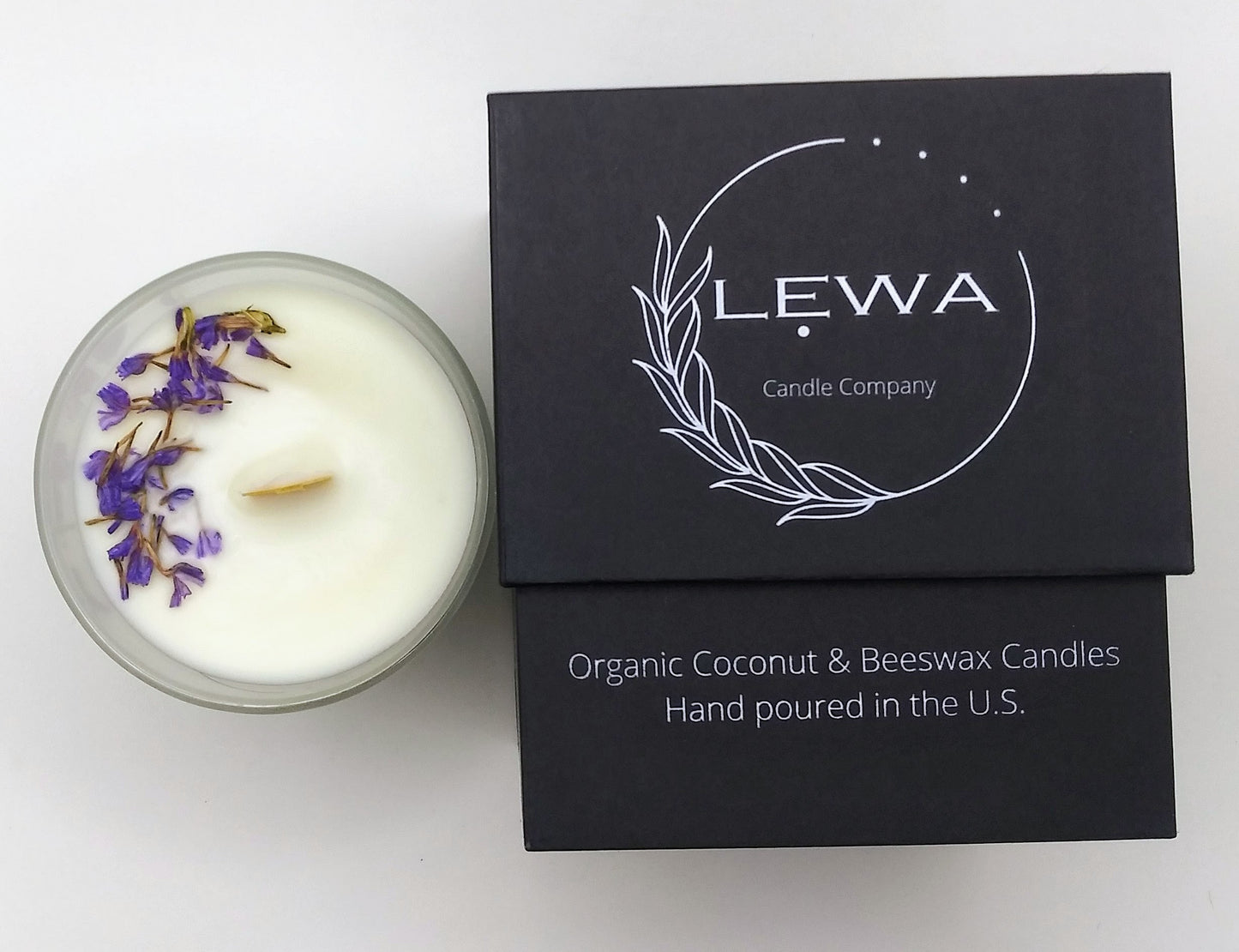 Top view of 'Confidence' Candle with dried floral decoration on top, beside the LEWA black signature box on white background.